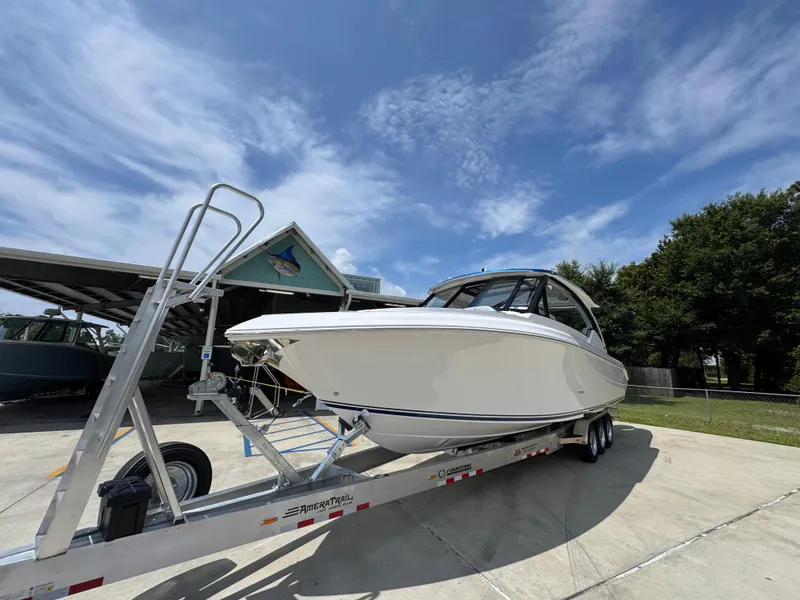 Slide: The Image of 2026 Fountain 39 DX boat on trailer under clear sky. - 4