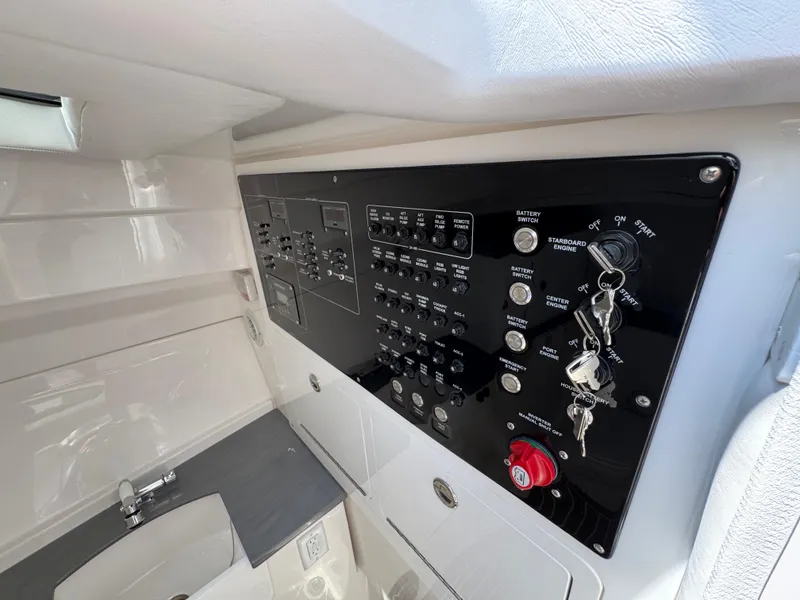 Slide: The Image of Control panel of 2026 Fountain 39 DX boat, featuring switches and keys. - 42