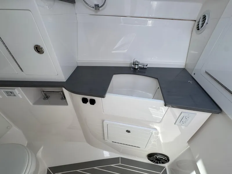 Slide: The Image of Modern bathroom interior of 2026 Fountain 39 DX boat with sleek fixtures and storage. - 44