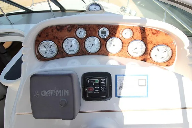 Slide: The Image of Dashboard of 2005 Larson Cabrio 310 boat with Garmin navigation system. - 8