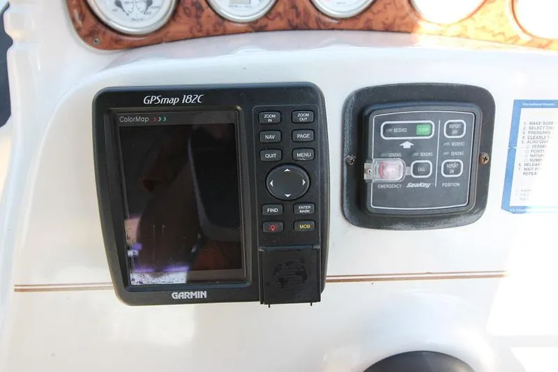 Slide: The Image of Garmin GPSmap 182C and control panel on 2005 Larson Cabrio 310 boat dashboard. - 9