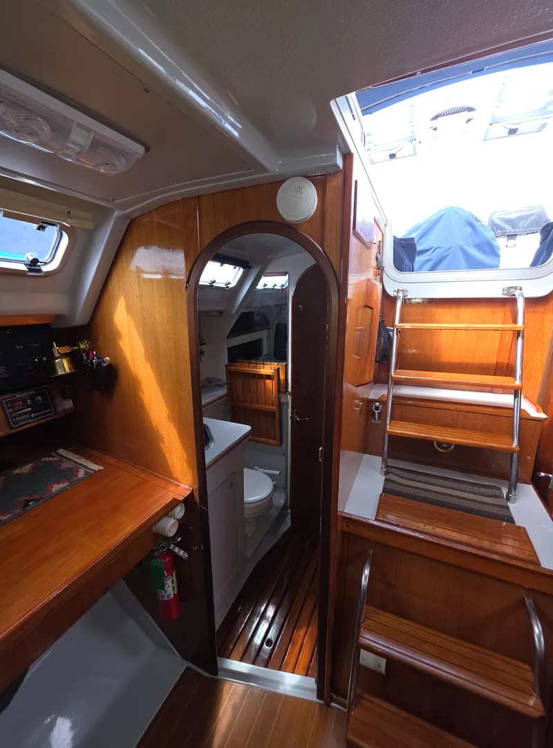 Slide: The Image of Interior of 1989 Hunter Legend 37 sailboat with wooden finishes and staircase. - 20