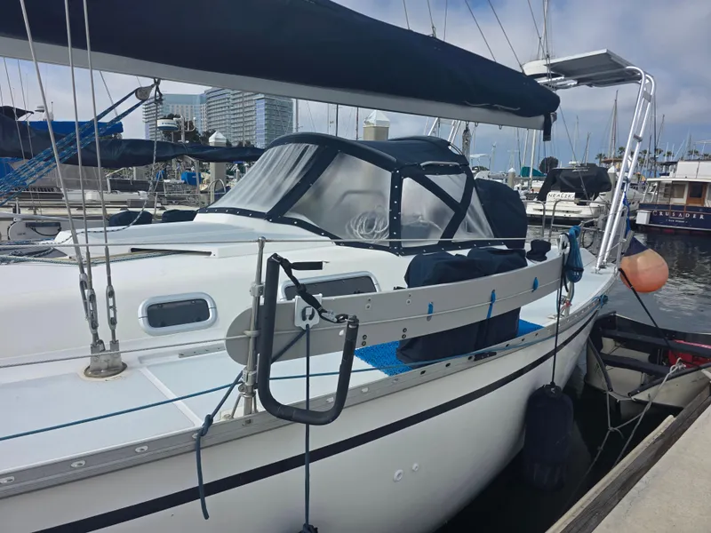 Slide: The Image of 1989 Hunter Legend 37 sailboat docked at marina, featuring sleek design and modern amenities. - 5