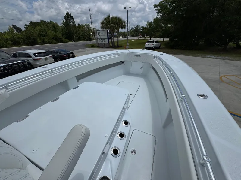 Slide: The Image of 2026 Invincible 33 Open Fisherman boat, spacious deck view, parked outdoors. - 20