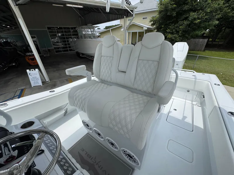 Slide: The Image of 2026 Invincible 33 Open Fisherman boat with luxurious white seating and modern design. - 32