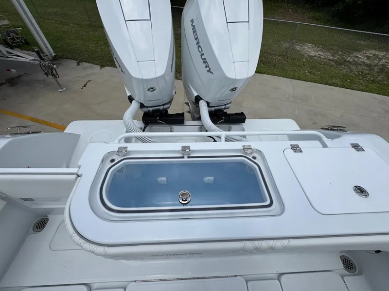 Slide: The Image of 2026 Invincible 33 Open Fisherman boat with dual Mercury engines and livewell. - 41