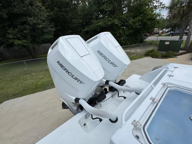 Slide: The Image of Twin Mercury outboard engines on a 2026 Invincible 33 Open Fisherman boat. - 43