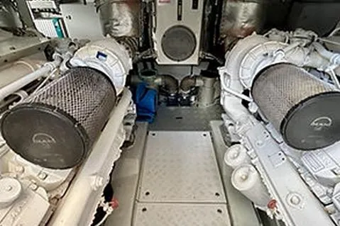 Slide: The Image of Engine room of 2015 Mazarin 72 Sport Fly yacht, showcasing dual engines and mechanical components. - 41
