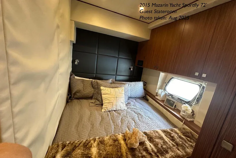 Slide: The Image of Luxurious guest stateroom in 2015 Mazarin 72 Sport Fly yacht, featuring elegant bedding and wood accents. - 50
