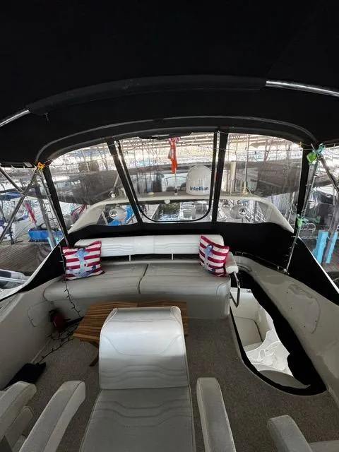 Slide: The Image of Interior view of 2004 Carver 360 Sport Sedan with seating and striped cushions. - 11