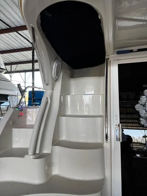 Slide: The Image of 2004 Carver 360 Sport Sedan yacht interior stairs under a covered dock. - 13