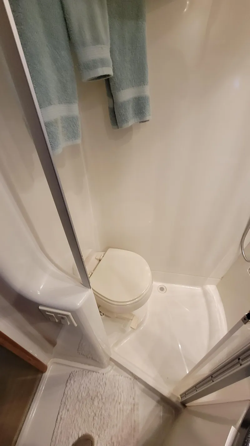 Slide: The Image of Compact bathroom in 2004 Carver 360 Sport Sedan with shower and toilet. - 40