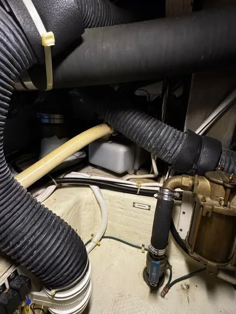 Slide: The Image of Engine compartment of a 2004 Carver 360 Sport Sedan with hoses and mechanical components. - 46