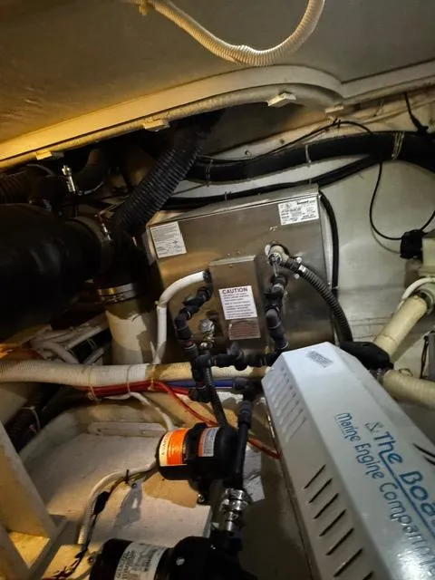 Slide: The Image of Engine room of a 2004 Carver 360 Sport Sedan with visible components and wiring. - 49