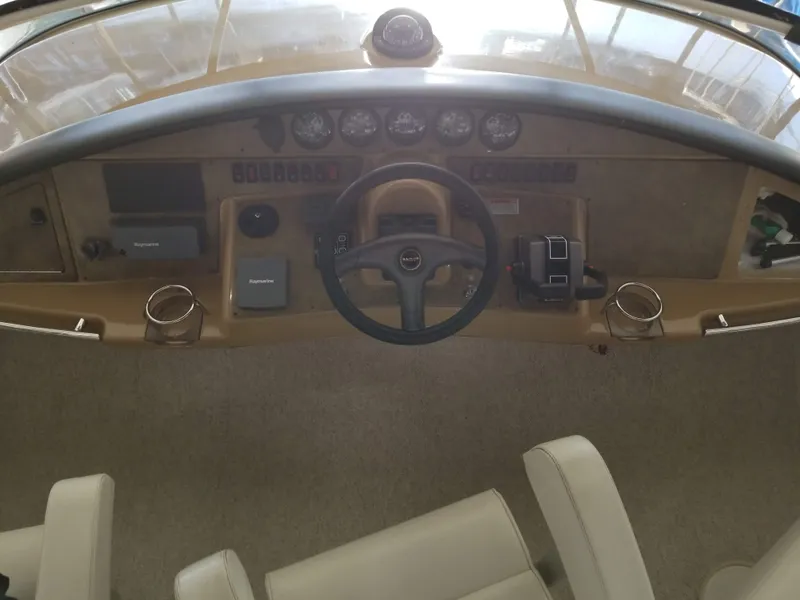 Slide: The Image of 2004 Carver 360 Sport Sedan helm with steering wheel and instrument panel. - 8
