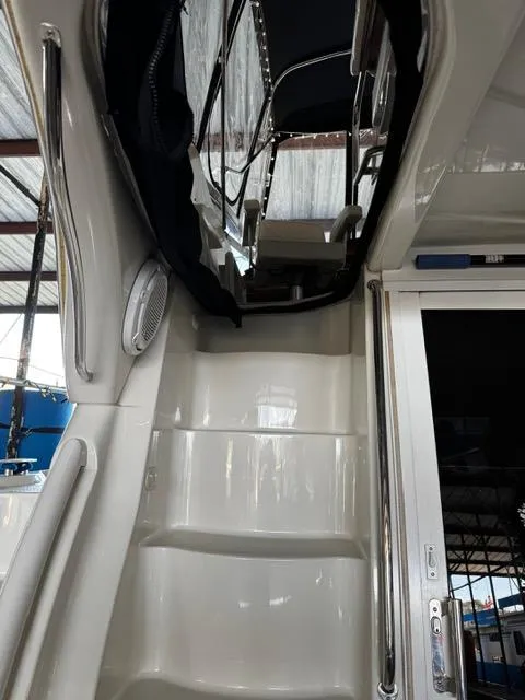 Slide: The Image of 2004 Carver 360 Sport Sedan interior stairs and door under a covered area. - 14