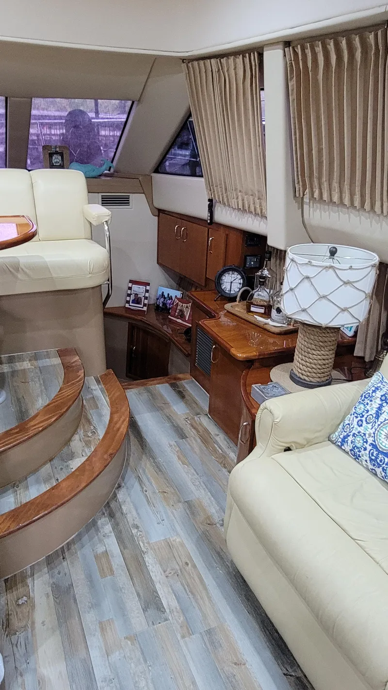 Slide: The Image of Interior of 2004 Carver 360 Sport Sedan with beige seating and wooden accents. - 26
