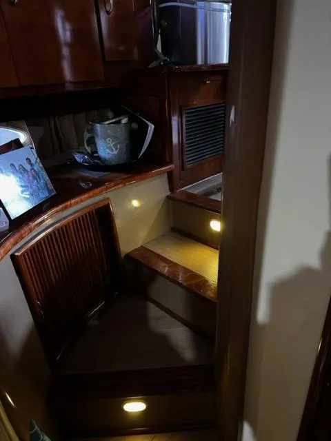 Slide: The Image of Interior of 2004 Carver 360 Sport Sedan with wooden stairs and ambient lighting. - 29