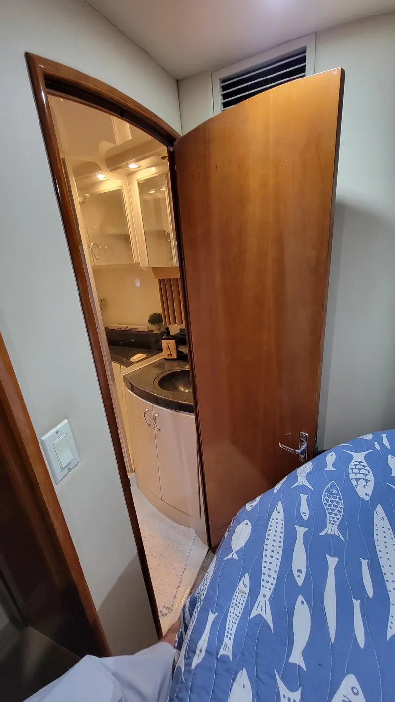 Slide: The Image of Interior view of 2004 Carver 360 Sport Sedan, showing a partially open door to a compact bathroom. - 33