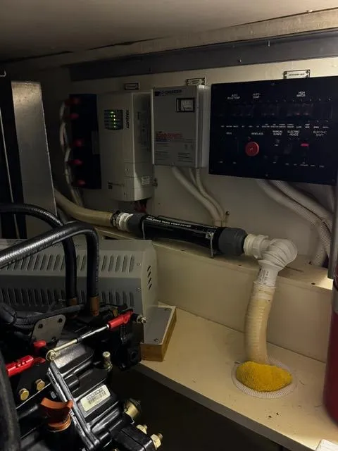 Slide: The Image of Engine room of a 2004 Carver 360 Sport Sedan with control panels and wiring. - 45