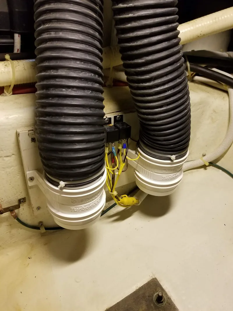 Slide: The Image of 2004 Carver 360 Sport Sedan engine room with ventilation hoses and wiring. - 47