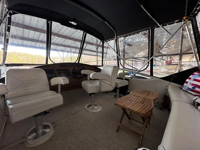 Slide: The Image of 2004 Carver 360 Sport Sedan interior with white seating and wooden table. - 6