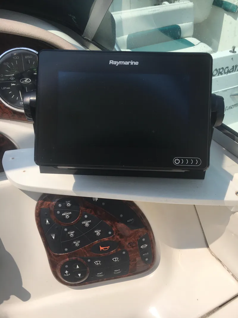 Slide: The Image of Raymarine navigation system on 2004 Sea Ray 280 Sundancer boat dashboard. - 10