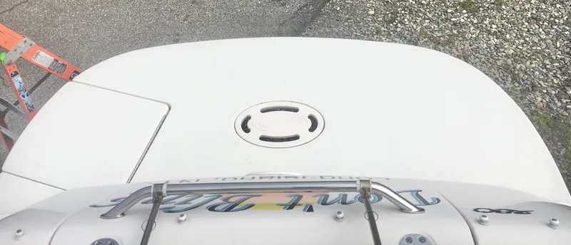 Slide: The Image of 2004 Sea Ray 280 Sundancer boat deck with ladder and hatch. - 14