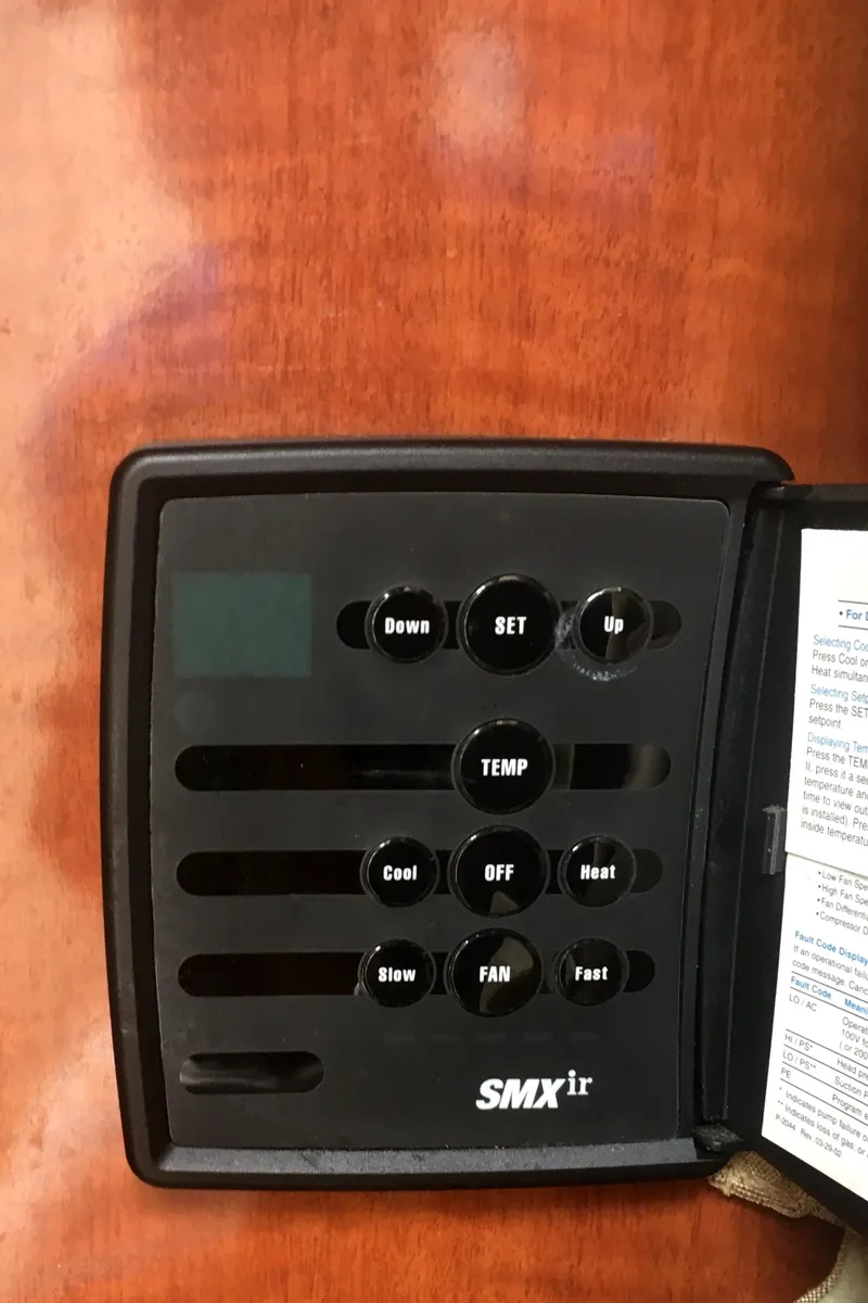 Slide: The Image of Control panel of a 2004 Sea Ray 280 Sundancer boat. - 24