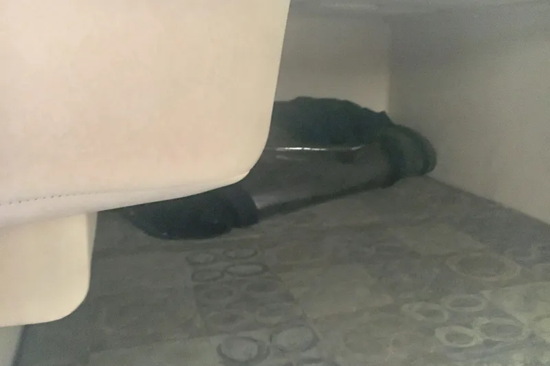 Slide: The Image of Interior cabin view of 2004 Sea Ray 280 Sundancer boat, featuring seating and flooring. - 26