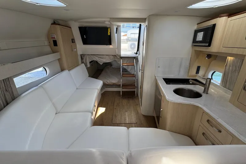 Slide: The Image of Luxurious interior of 2026 Regal 33 XO yacht with modern kitchen and seating area. - 118