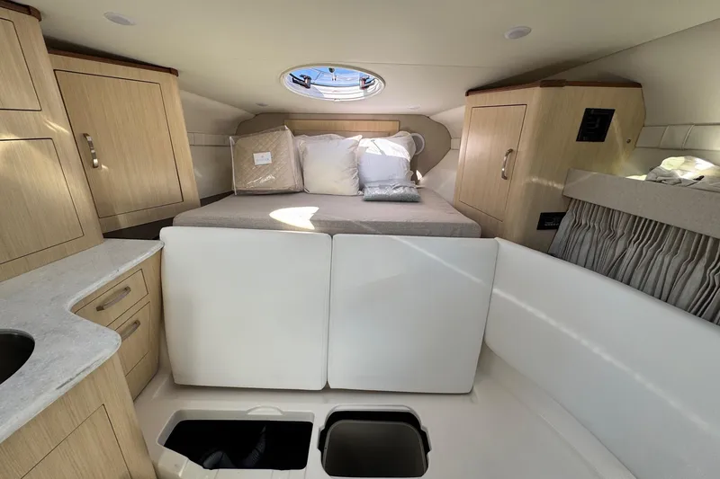 Slide: The Image of 2026 Regal 33 XO cabin interior with bed, storage, and modern amenities. - 126