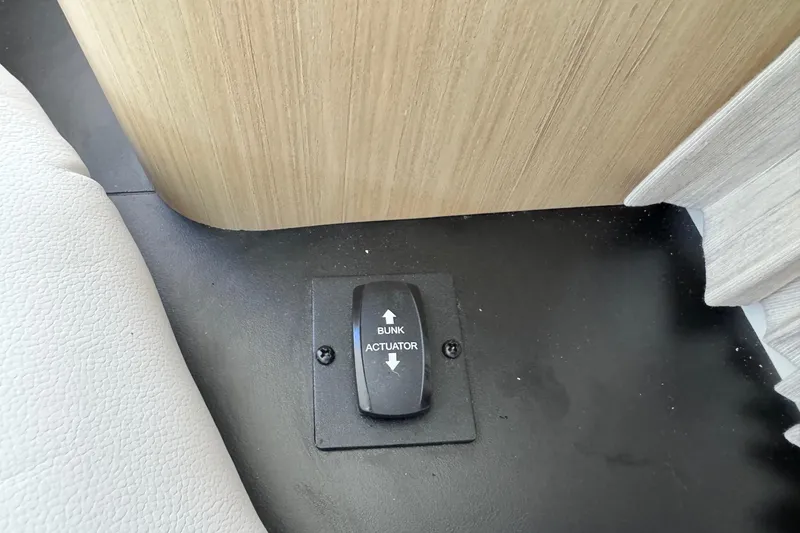 Slide: The Image of Bunk actuator switch in 2026 Regal 33 XO boat interior. - 128