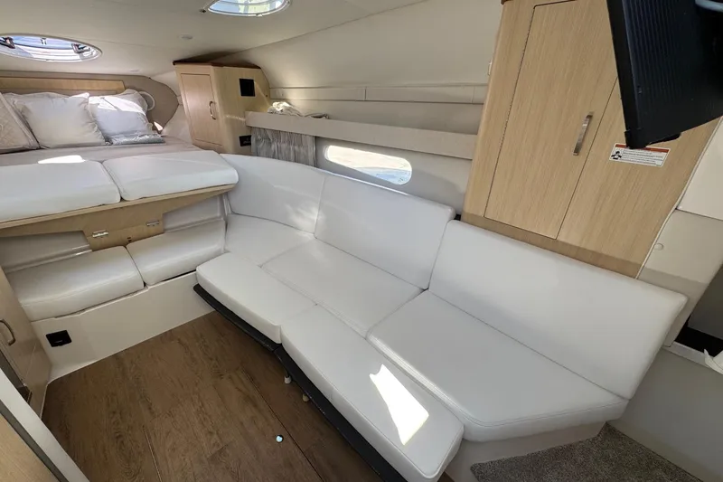 Slide: The Image of Luxurious interior of 2026 Regal 33 XO yacht with white seating and wood accents. - 131