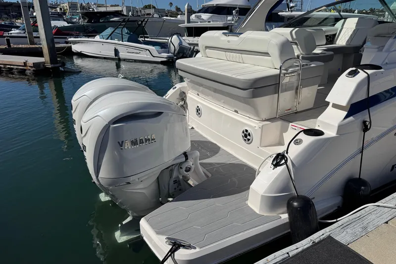 Slide: The Image of 2026 Regal 33 XO boat with Yamaha outboard engines docked at marina. - 36