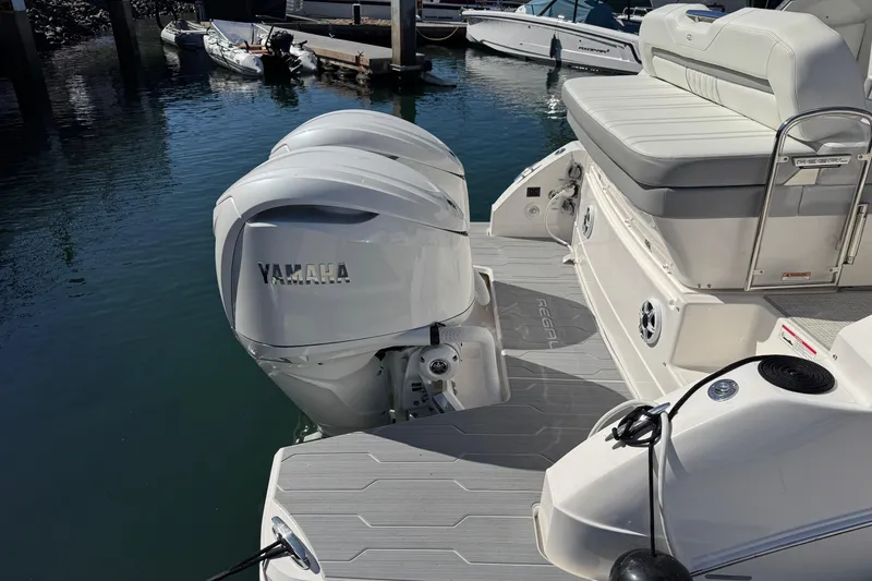 Slide: The Image of 2026 Regal 33 XO boat with Yamaha outboard engines docked at marina. - 37
