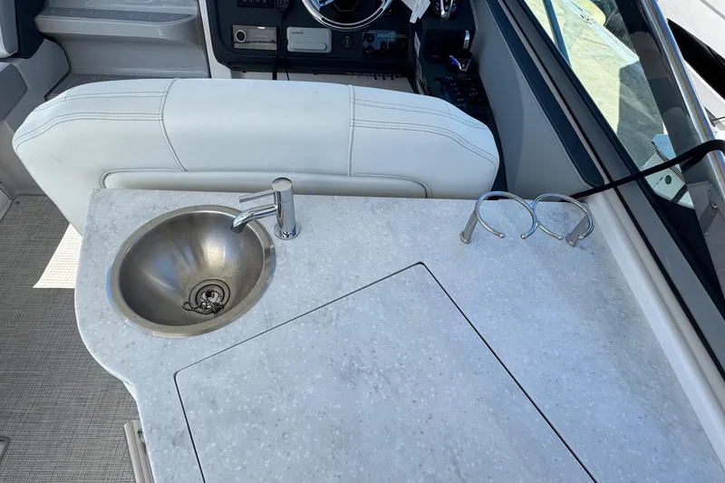 Slide: The Image of 2026 Regal 33 XO boat interior with sink and countertop detail. - 55