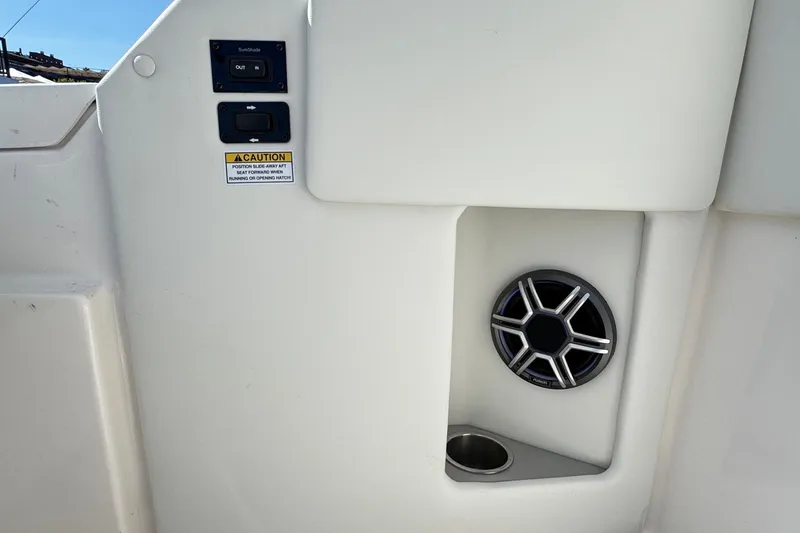 Slide: The Image of 2026 Regal 33 XO boat interior with speaker and control panel. - 58