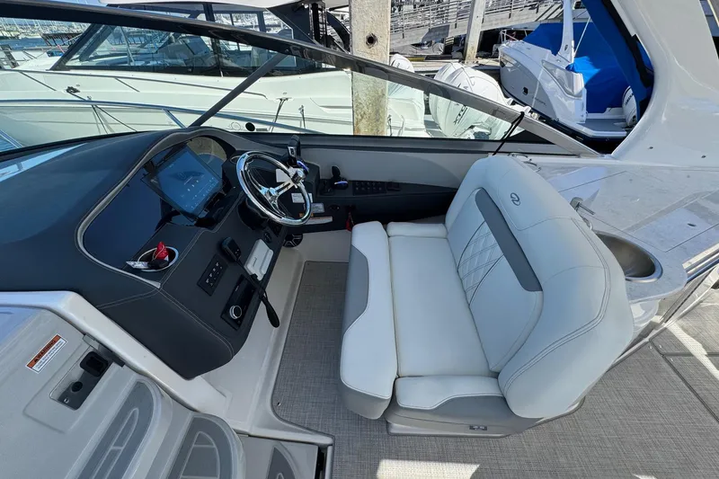 Slide: The Image of 2026 Regal 33 XO boat interior with modern helm and luxurious seating. - 72