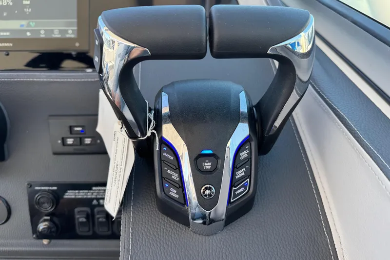 Slide: The Image of Throttle control of 2026 Regal 33 XO boat, featuring advanced navigation buttons. - 77
