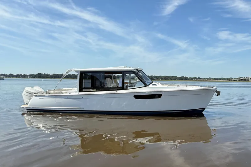 The Image of 2026 MJM 38x boat on calm water under clear blue sky. - 0