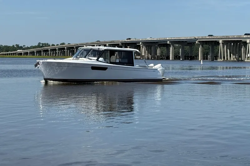 Slide: The Image of Luxurious interior of 2026 MJM 38x yacht with seating and helm station. - 10