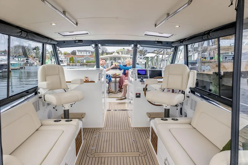 Slide: The Image of Luxurious seating area on 2026 MJM 38x yacht with elegant wooden table. - 20