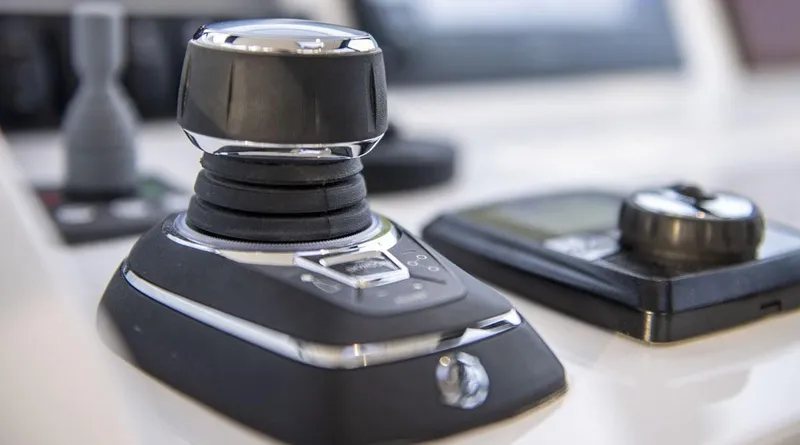 Slide: The Image of Luxurious seating on 2026 MJM 3 boat with beige cushions and orange pillow. - 22