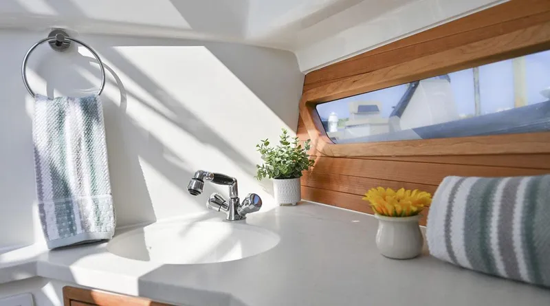 Slide: The Image of Luxury interior of 2026 MJM 38x boat with plush seating and scenic water view. - 23