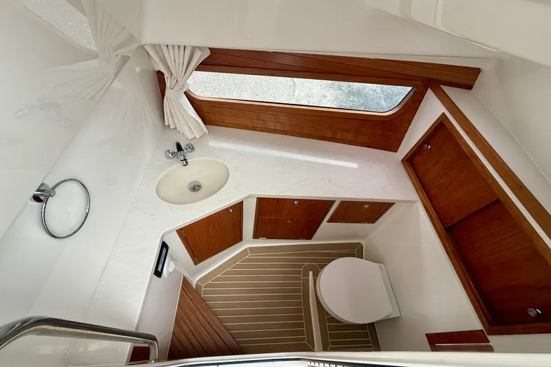 Slide: The Image of Helm of 2026 MJM 38x boat with navigation screens and controls. - 25