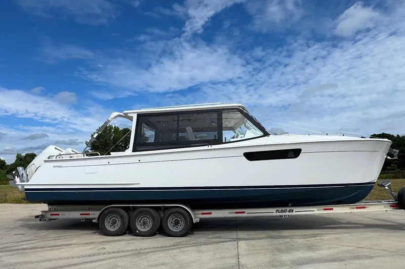 Slide: The Image of Modern boat bathroom with sleek sink, wooden accents, and decorative plants in MJM 3, 2026 model. - 27