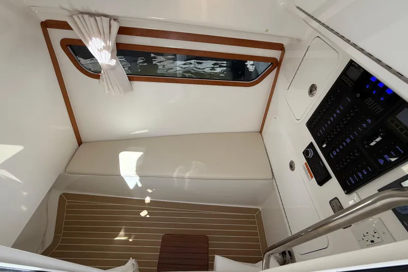 Slide: The Image of Interior of 2026 MJM 38x boat with control panel and seating area. - 30