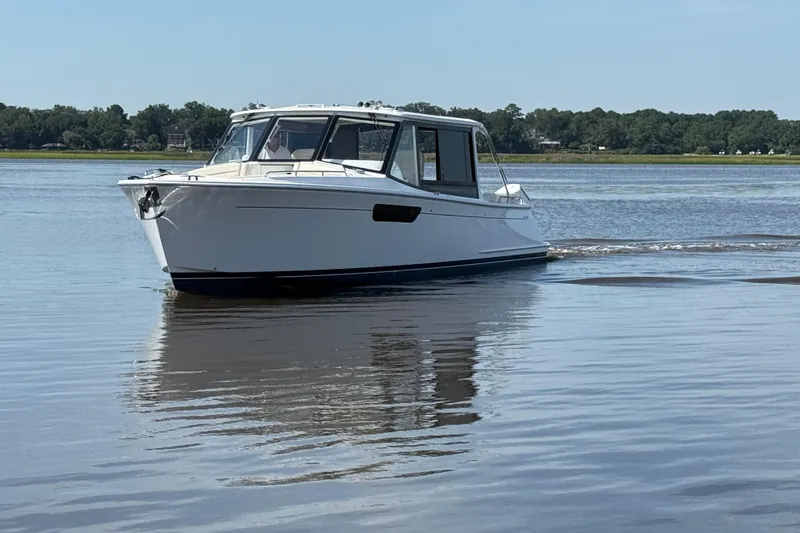 Slide: The Image of Luxurious 2026 MJM 38x yacht interior with beige seating and stylish decor. - 9