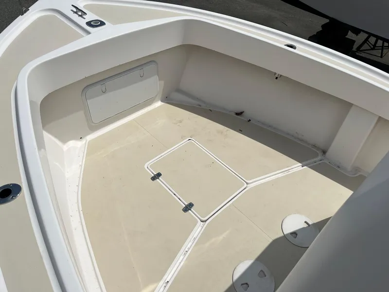 Slide: The Image of 2018 NorthCoast 190 Center Console boat interior, featuring spacious deck and storage compartments. - 14